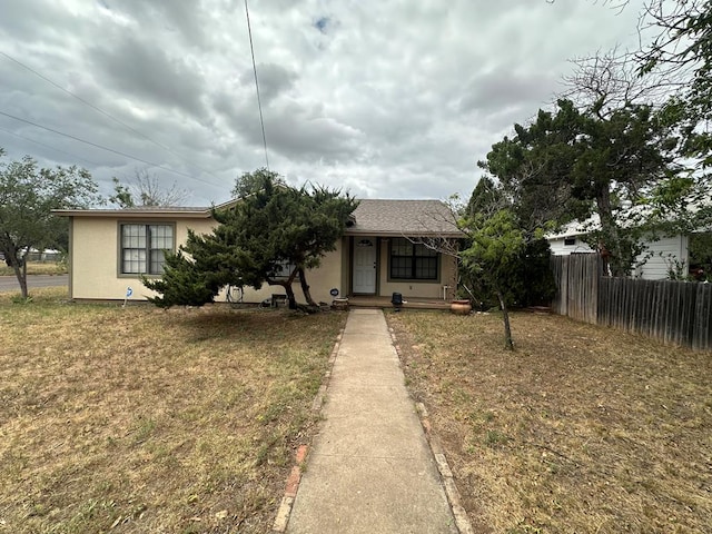 bungalow-style house with a front lawn