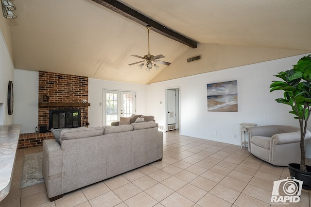 tiled living room featuring ceiling fan, a fireplace, high vaulted ceiling, and beamed ceiling