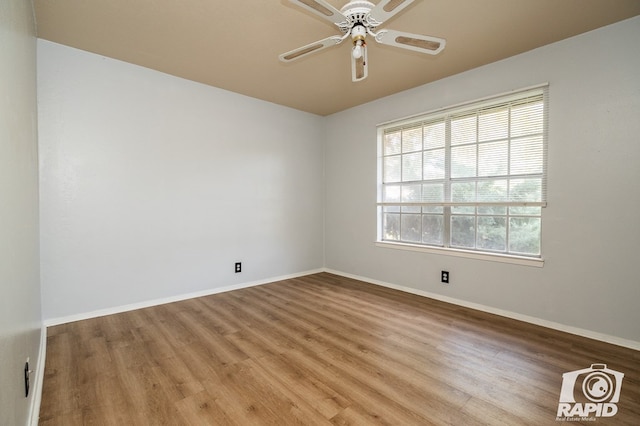 empty room featuring ceiling fan and light hardwood / wood-style floors