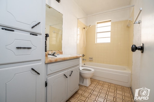 full bathroom featuring vanity, toilet, and tiled shower / bath combo