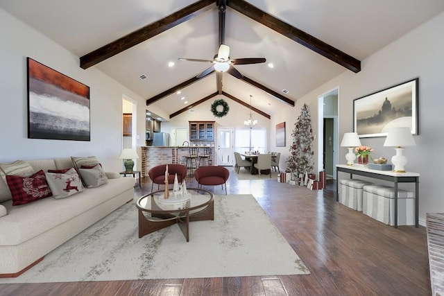 living room featuring hardwood / wood-style floors, ceiling fan with notable chandelier, high vaulted ceiling, and beamed ceiling