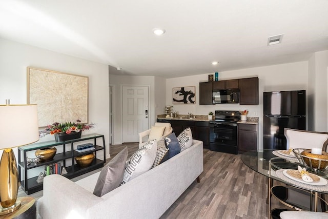 living room featuring dark wood-type flooring