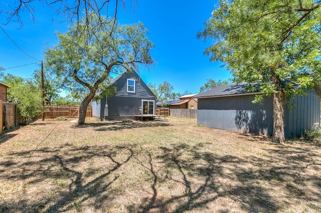 rear view of property with a yard