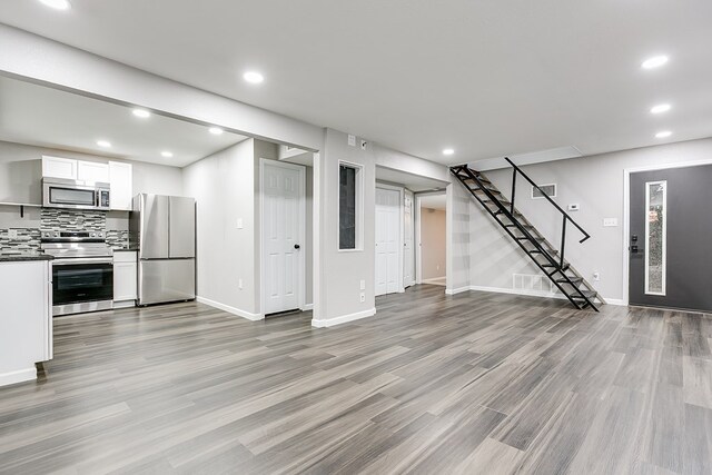 unfurnished living room featuring light wood-type flooring