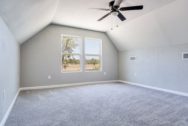 additional living space with lofted ceiling, carpet floors, and ceiling fan