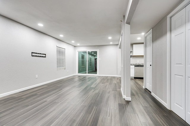 unfurnished living room featuring dark wood-type flooring