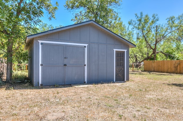 view of outbuilding with a yard