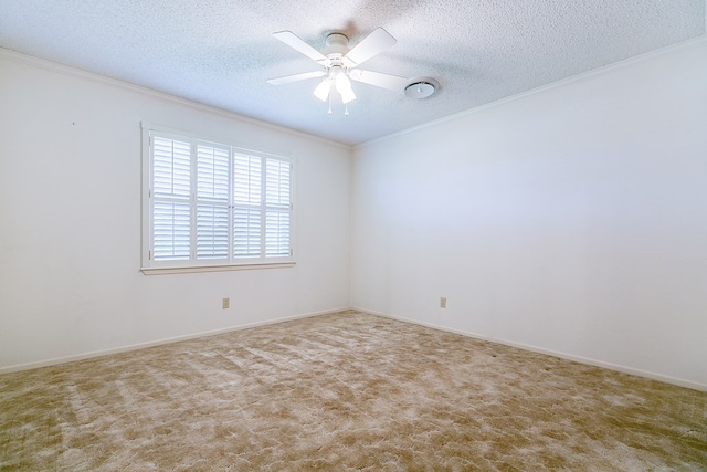 spare room featuring light carpet, ceiling fan, ornamental molding, and a textured ceiling