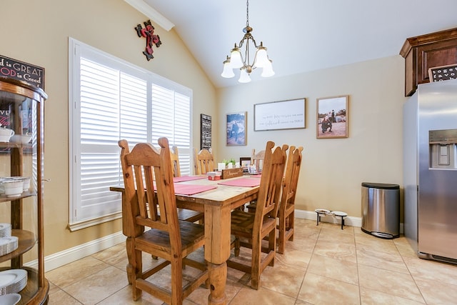 dining area featuring vaulted ceiling, baseboards, a notable chandelier, and light tile patterned flooring