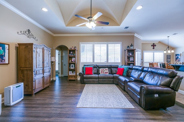 living area featuring vaulted ceiling, ceiling fan with notable chandelier, arched walkways, dark wood-type flooring, and visible vents