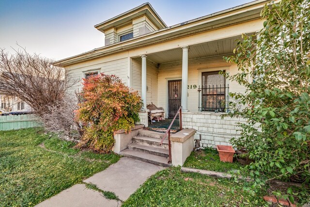219 Bird St, San Angelo, TX 79603 - property entrance featuring a lawn and covered porch