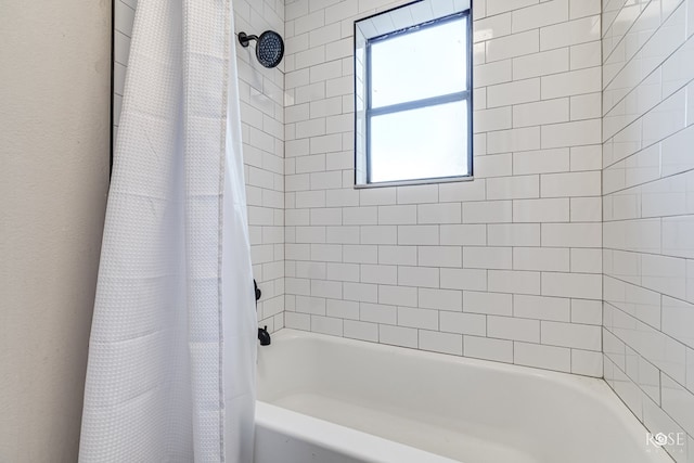 bathroom featuring shower / tub combo with curtain