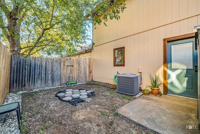 view of yard with a patio and central AC unit