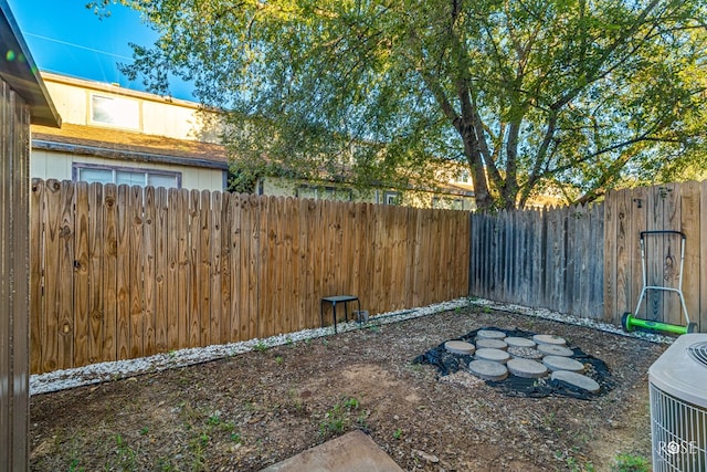 view of yard featuring central AC