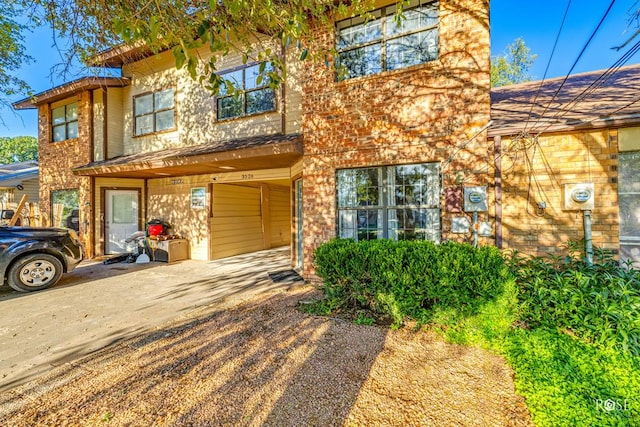 view of front of property with a carport