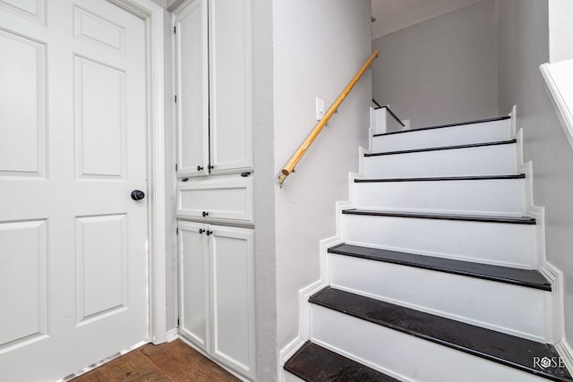 staircase featuring hardwood / wood-style flooring