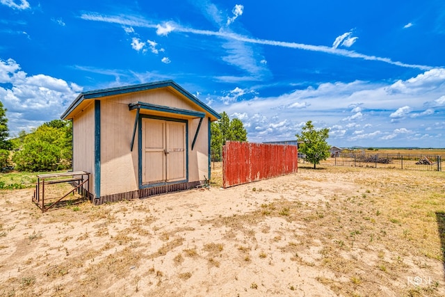 view of shed with fence