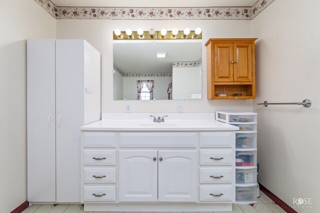 bathroom featuring vanity and baseboards