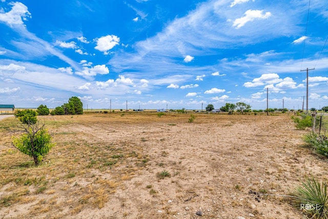 view of yard with a rural view