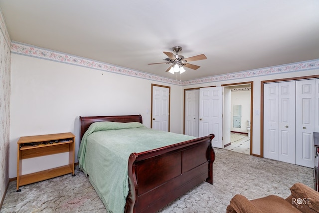bedroom featuring light carpet, baseboards, two closets, and a ceiling fan