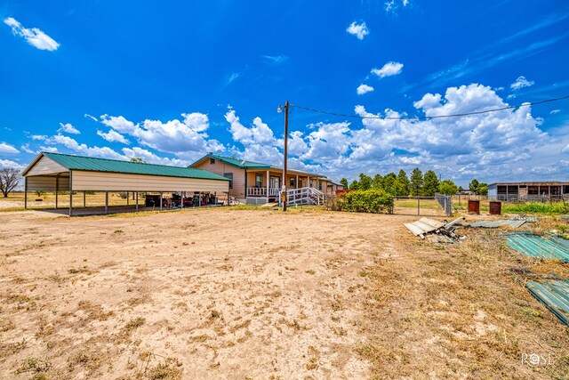 view of yard with a carport