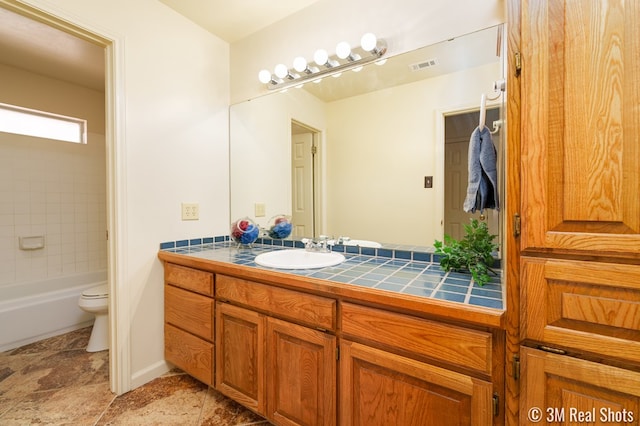 full bath featuring visible vents, toilet, and vanity