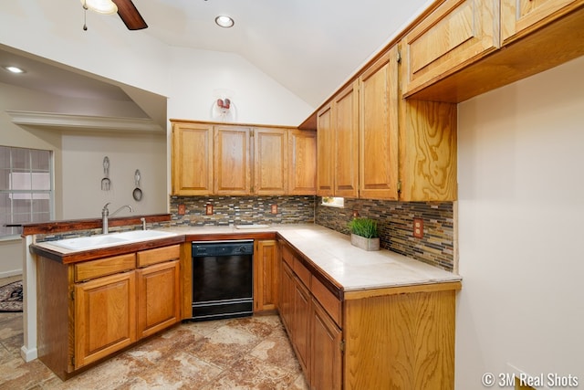 kitchen featuring tasteful backsplash, dishwasher, vaulted ceiling, a peninsula, and a sink