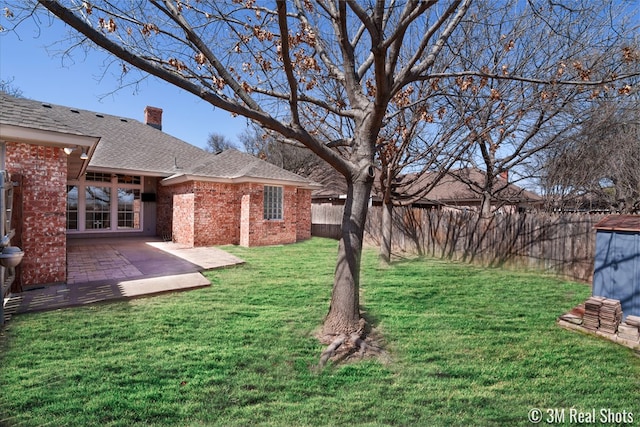 view of yard with a patio and fence