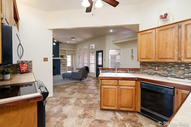 kitchen with black dishwasher, decorative backsplash, a fireplace, electric stove, and a sink