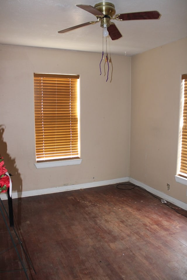 unfurnished room featuring dark hardwood / wood-style flooring and ceiling fan