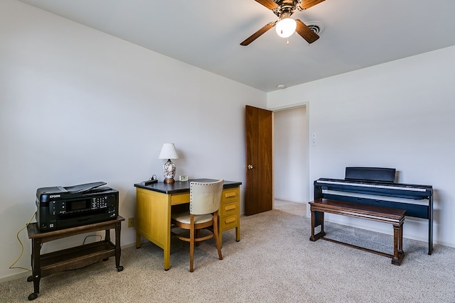 office with visible vents, baseboards, a ceiling fan, and light colored carpet