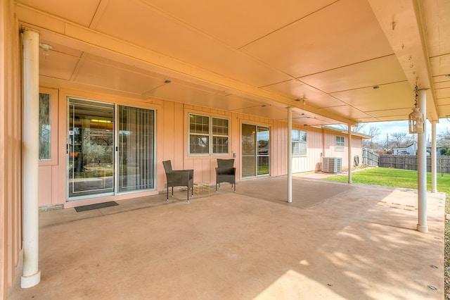 view of patio featuring fence and central AC