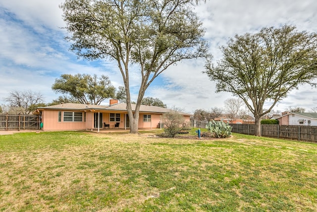 view of yard with a patio and a fenced backyard