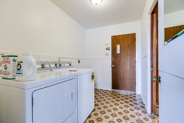 washroom with laundry area, washer and clothes dryer, and light floors