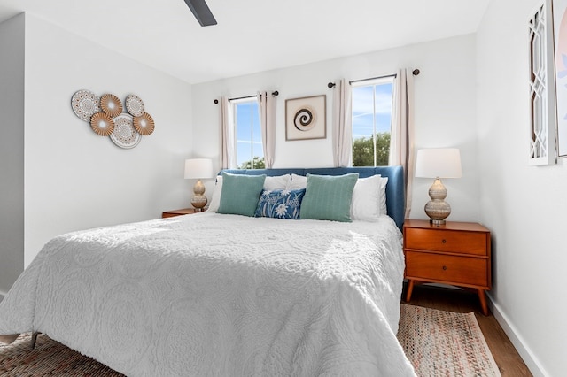 bedroom with hardwood / wood-style floors and ceiling fan