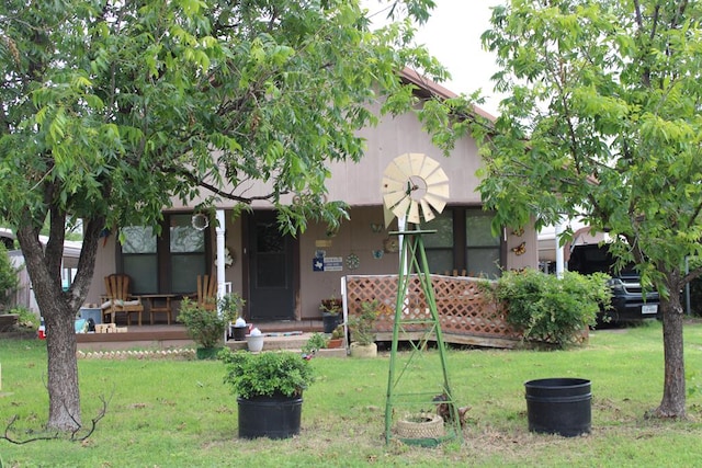 rear view of house with a yard