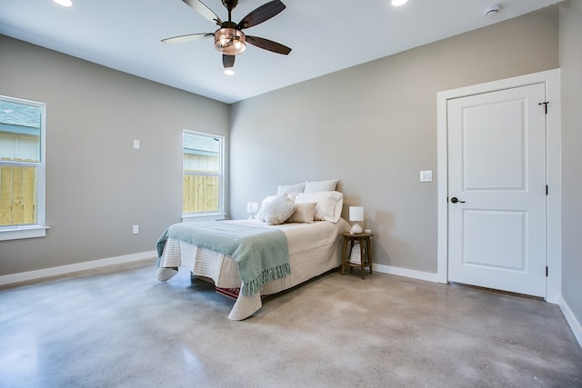 2114 Deaton St, San Angelo, TX 76903 - bedroom featuring baseboards, finished concrete flooring, recessed lighting, and a ceiling fan
