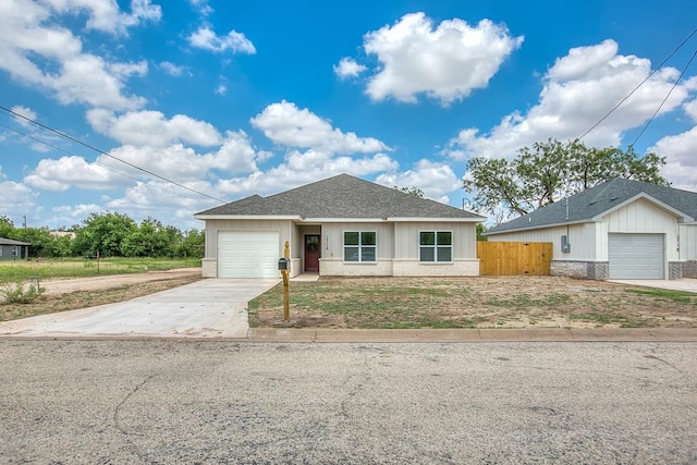 2114 Deaton St, San Angelo, TX 76903 - single story home featuring concrete driveway, brick siding, a garage, and a shingled roof