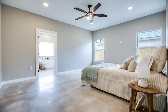 2114 Deaton St, San Angelo, TX 76903 - bedroom featuring baseboards, recessed lighting, concrete flooring, connected bathroom, and a ceiling fan