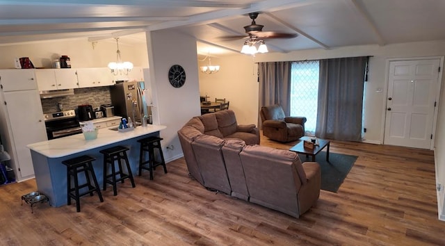 2709 Rice Ave, San Angelo, TX 76904 - living room with a chandelier, ceiling fan, and wood finished floors