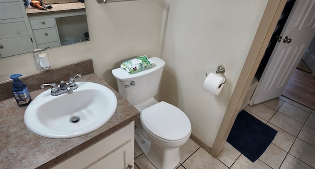 2709 Rice Ave, San Angelo, TX 76904 - half bathroom with vanity and tile patterned floors