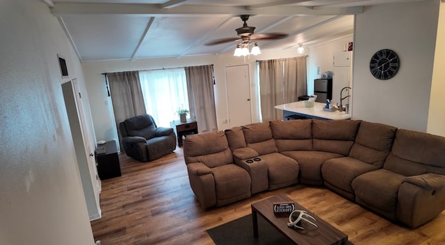 2709 Rice Ave, San Angelo, TX 76904 - living area with light wood finished floors, ceiling fan, and beam ceiling
