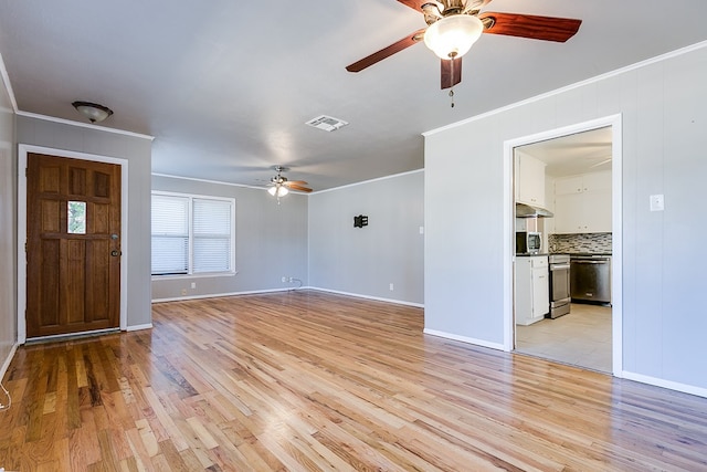 unfurnished living room featuring ceiling fan, ornamental molding, and light hardwood / wood-style floors