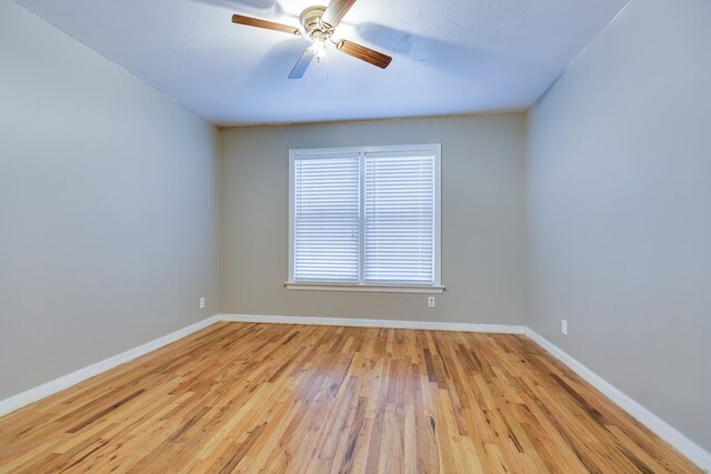 unfurnished room featuring light hardwood / wood-style flooring and ceiling fan