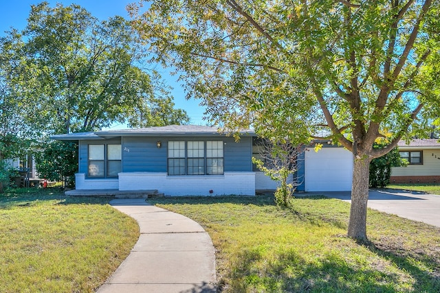 ranch-style house with a garage and a front yard