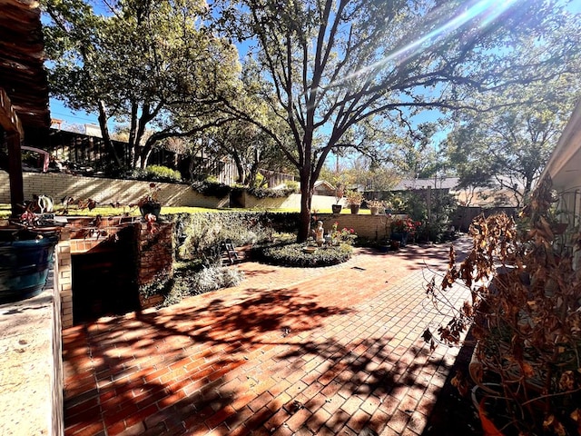 view of yard featuring fence and a patio area