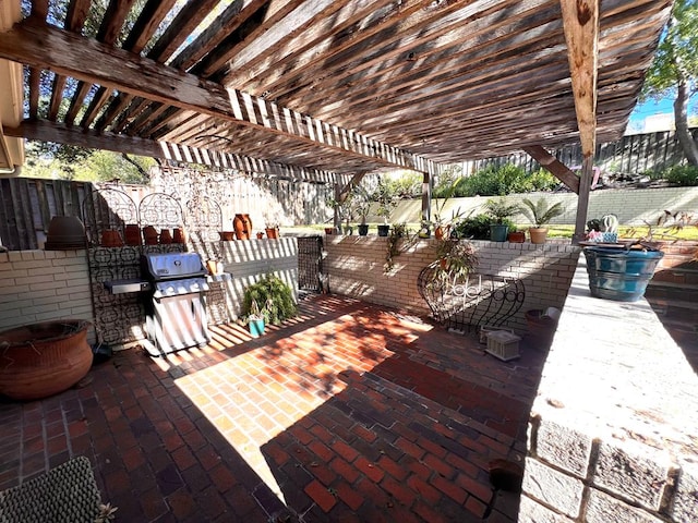 view of patio / terrace featuring fence, a pergola, and a grill