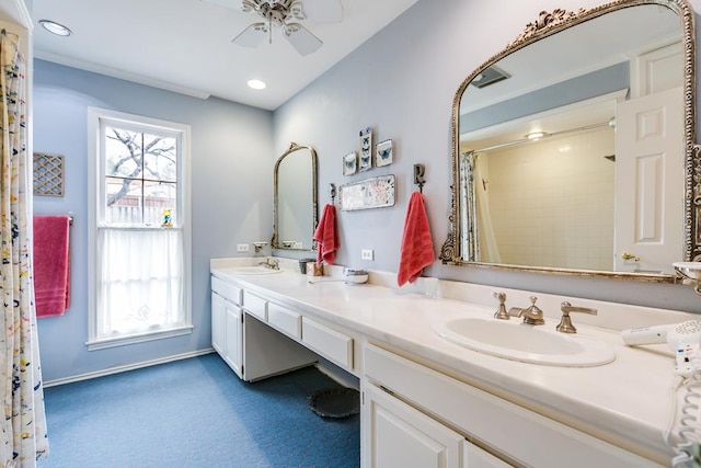 full bathroom with a shower with shower curtain, a ceiling fan, a healthy amount of sunlight, and a sink