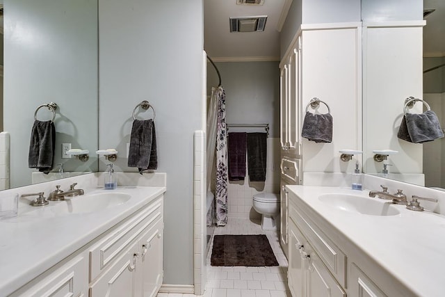 full bathroom featuring a sink, two vanities, and tile patterned floors