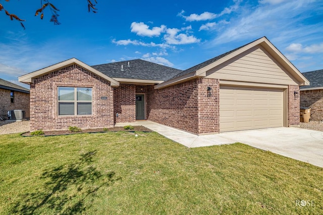 ranch-style house featuring a garage and a front lawn